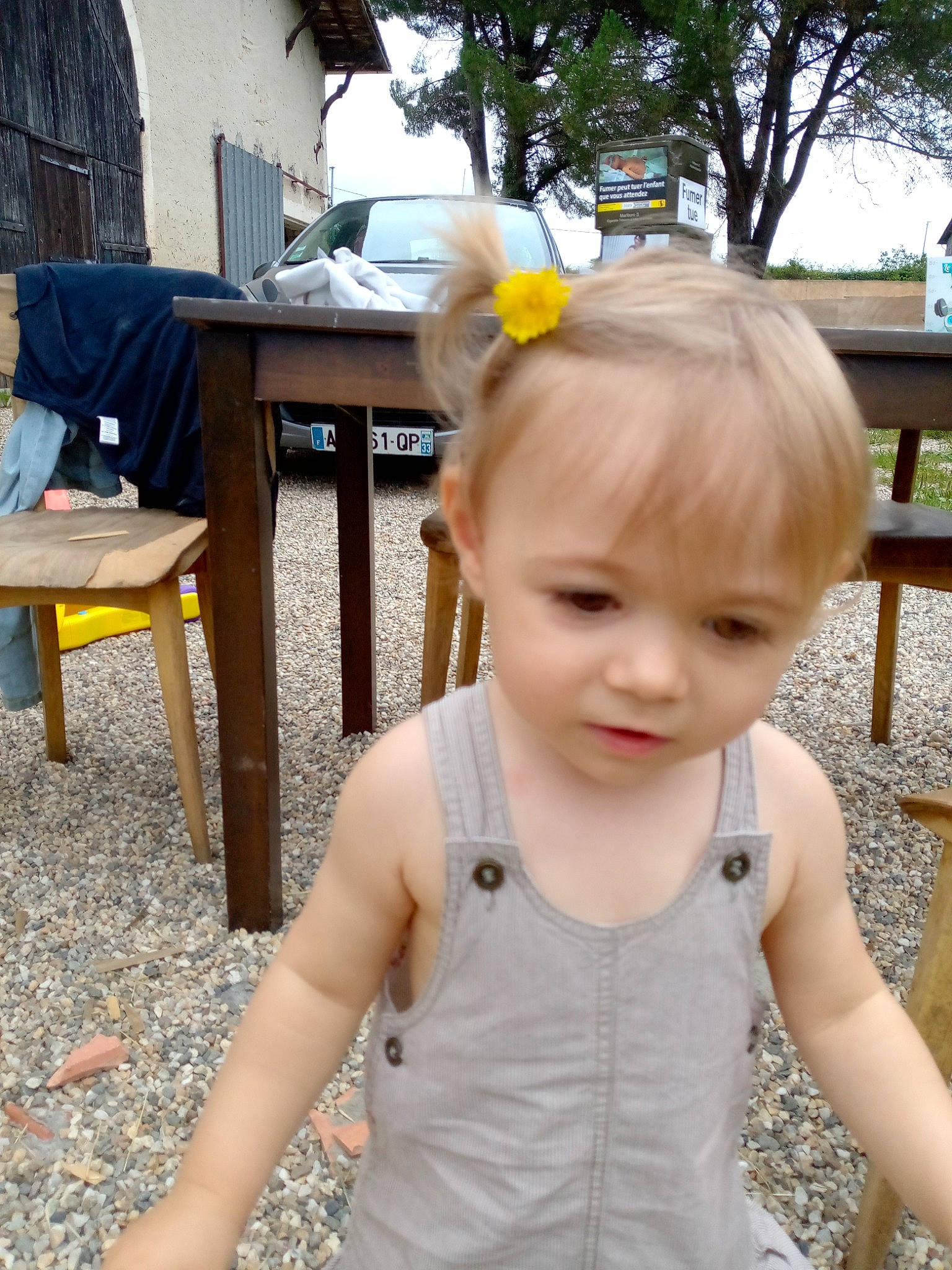 Amalia participe au concours pour gagner de l'argent avec cette photo : baby, baby_toddler_clothing, car, chair, child, fun, grass, hairstyle, happy, leisure, outdoor_furniture, pattern, person, plant, sitting, sky, sleeve, t_shirt, toddler, tree