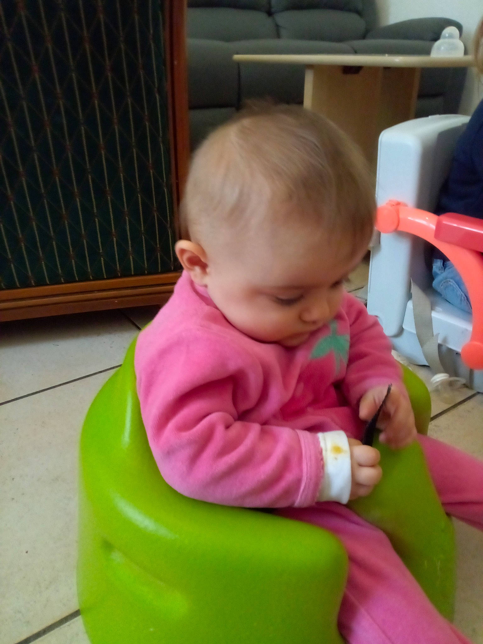 Naomie participe au concours pour gagner de l'argent avec cette photo : baby, baby_playing_with_toys, baby_products, baby_toddler_clothing, baby_toys, chair, cheek, child, cleanliness, comfort, flooring, fun, grass, lap, leisure, magenta, person, play, riding_toy, sitting