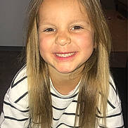 Ivanna a rejoint le concours — aidez-le/la à gagner de superbes lots ! child, smiling, indoor, long_hair, blonde_hair, striped_shirt, happy, portrait, person, casual_clothing, young, face, cute, seated, light_skin, childhood, joyful, human, looking_at_camera, sitting