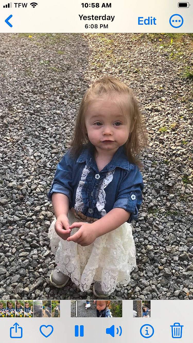 Pebbles is registered to the contest to win money with this photo: asphalt, baby_toddler_clothing, beauty, blond, child, flash_photography, fun, grass, happy, headwear, human, nature, pattern, people_in_nature, person, play, road_surface, sitting, smile, soil