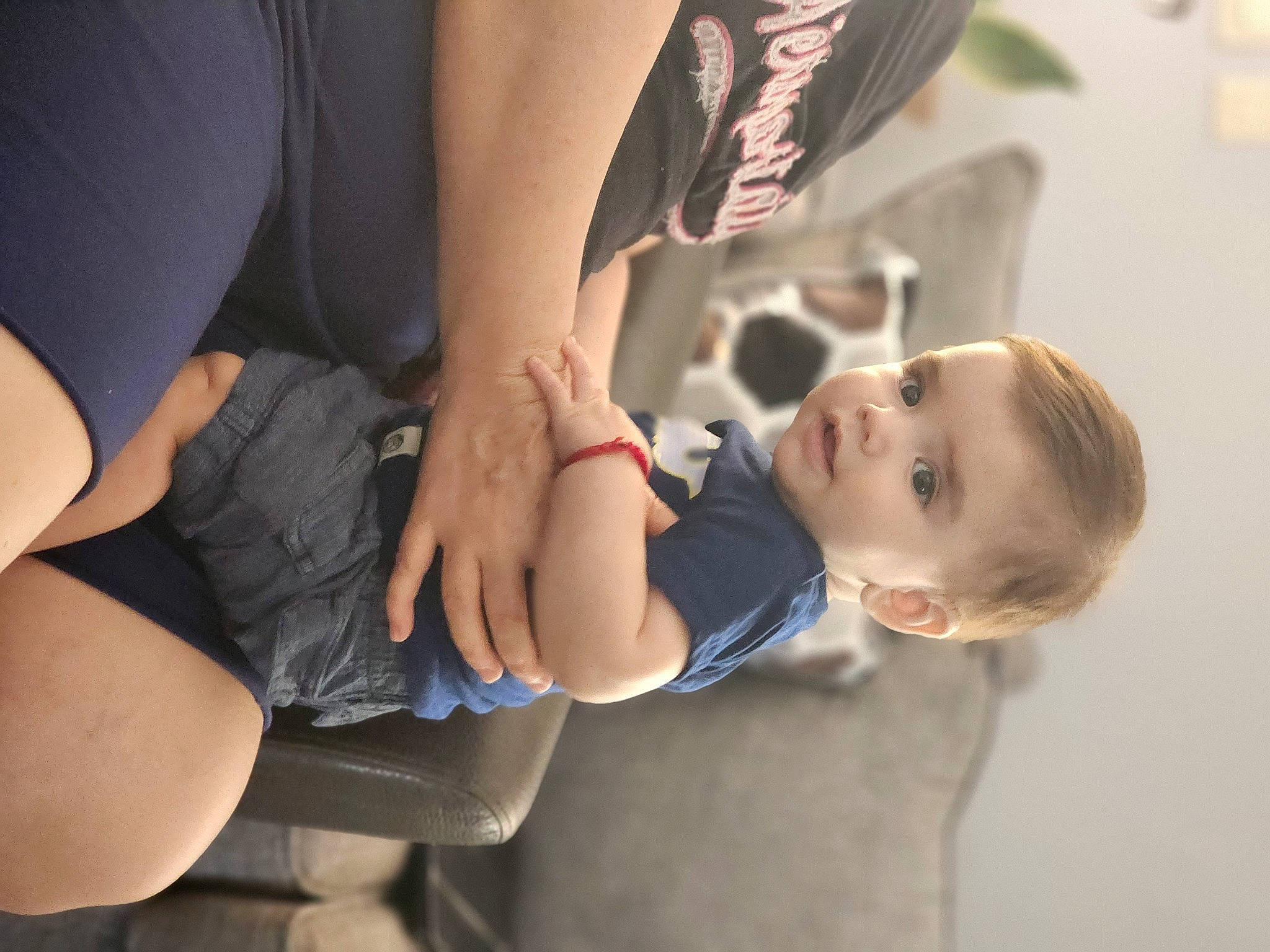 Alexander is registered to the contest to win money with this photo: abdomen, child, comfort, dress, elbow, electric_blue, flash_photography, fun, gesture, happy, human_leg, joint, knee, leg, person, sitting, thigh, toddler, tree, trunk