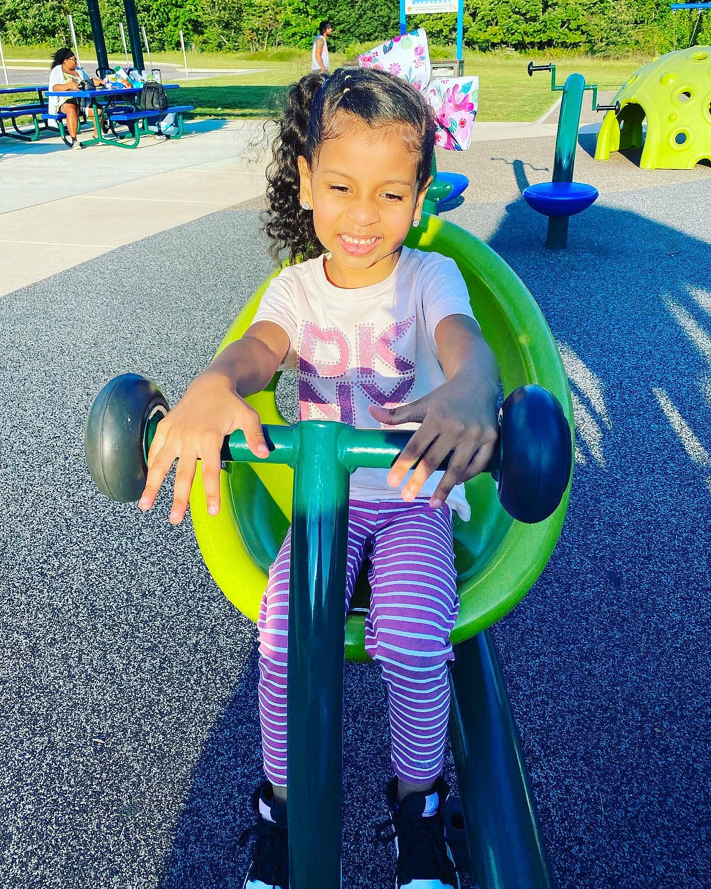 Kaylee Sofia Marie joined the competition — help win amazing prizes! asphalt, automotive_wheel_system, child, city, electric_blue, fun, grass, green, happy, joy, leisure, outdoor_play_equipment, outdoor_recreation, person, play, playground, recreation, riding_toy, sitting, smile