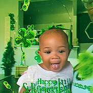 Nevaeh joined the competition — help win amazing prizes! toddler, child, happy, smiling, indoor, st_patricks_day, green_clothing, holiday_theme, shamrocks, festive, family, person, celebration, glasses, adult, living_room, home, sparkles, fun, portrait