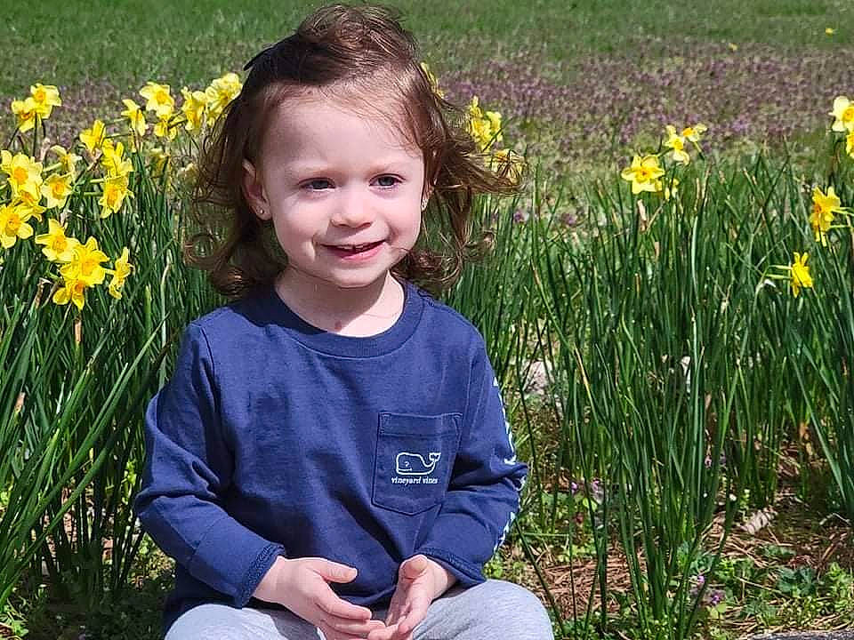 Reagan is registered to the contest to win money with this photo: botany, eye, flower, flowering_plant, garden, grass, grass_family, grassland, happy, iris, joy, meadow, natural_landscape, people_in_nature, person, petal, plant, prairie, smile, summer