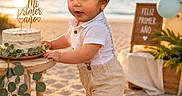 Alexandro is registered to the contest to win money with this photo: balloons, beach, birthday, cake, celebration, child, greenery, happy, number_one, outdoor, party, plants, sand, shirt, shoes, shorts, sign, sunset, toddler, wooden_table