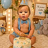Alexandro joined the competition — help win amazing prizes! baby, birthday, blue, bow_tie, cake, celebration, child, cute, decorations, elephant_toy, first_birthday, indoor, lights, number_one, party_hat, photo_shoot, plush_toys, smiling, suspenders, teddy_bear
