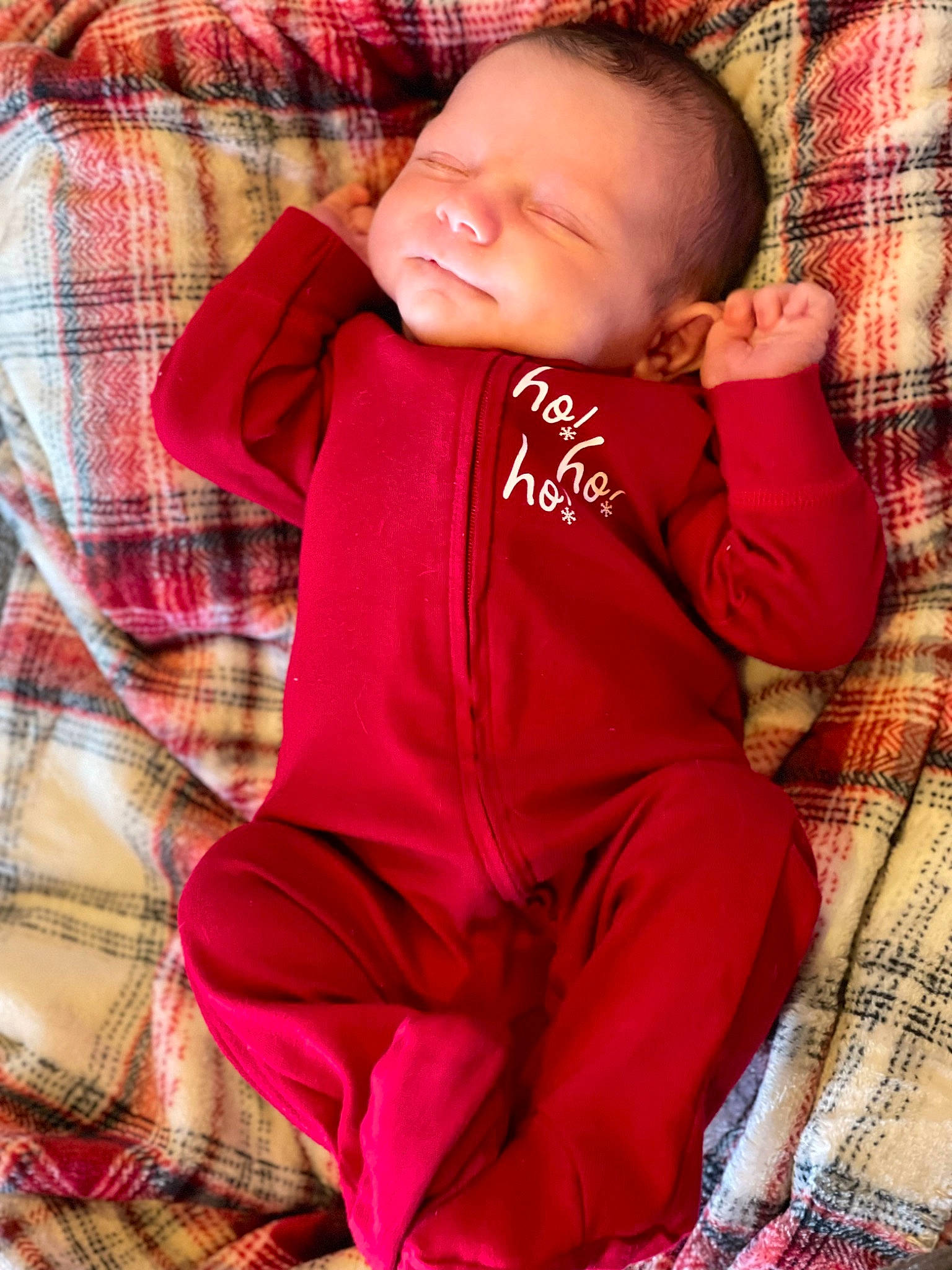 Harlan is registered to the contest to win money with this photo: baby, baby_toddler_clothing, bedding, cheek, child, comfort, face, head, linens, magenta, pattern, person, pink, plaid, sitting, skin, sleeve, t_shirt, tartan, textile