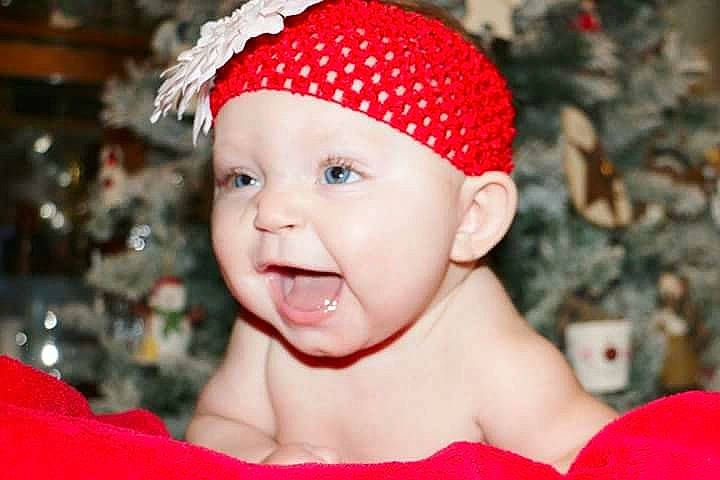 Mckinlee is registered to the contest to win money with this photo: cap, child, christmas, clothing, dress, flower, girl, head, infant, person, portrait, red, skin, smile, sweetness, toddler