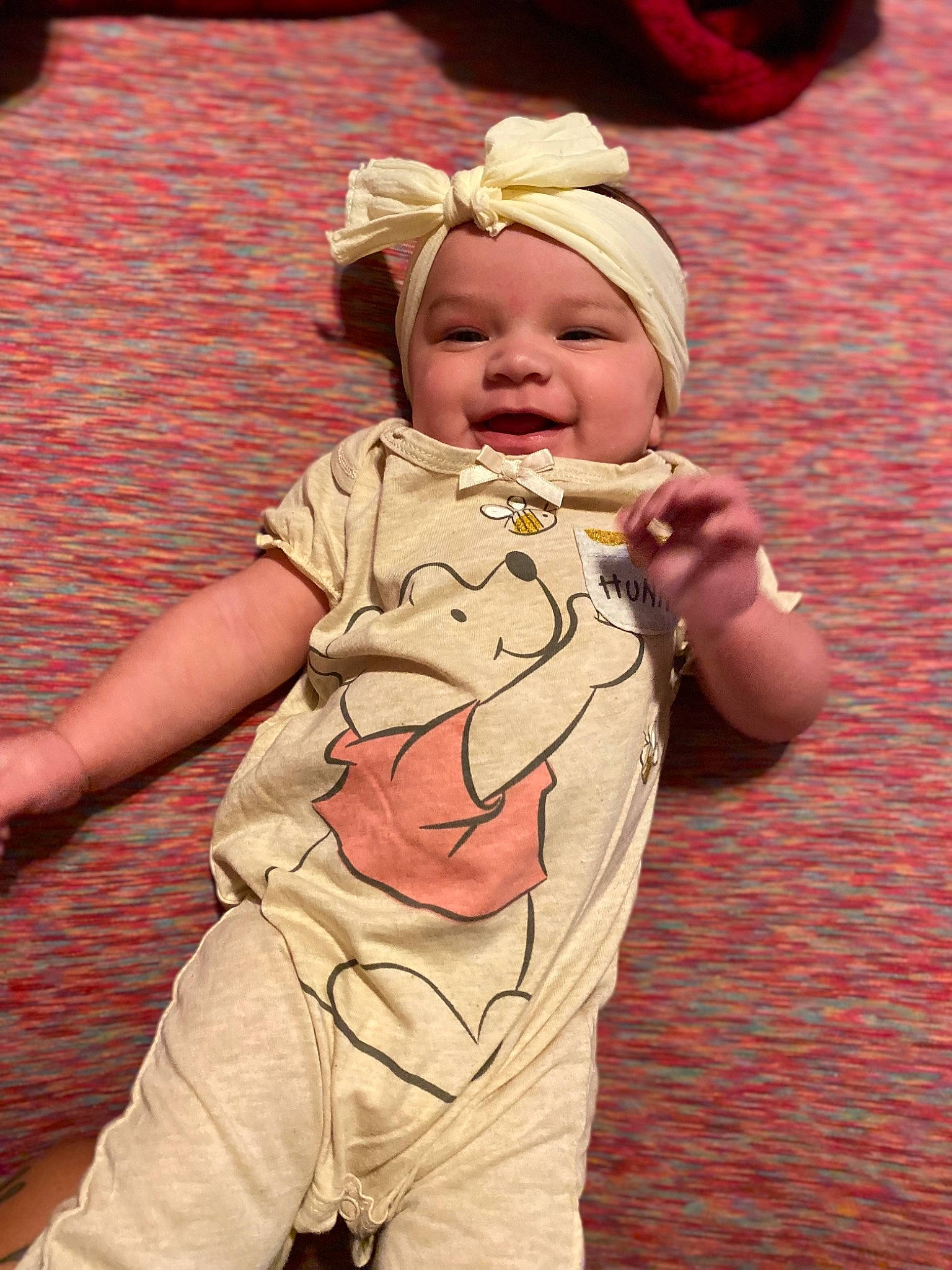 Halo is registered to the contest to win money with this photo: baby, baby_laughing, baby_toddler_clothing, cheek, child, finger, fun, gesture, grass, hand, happy, hat, headwear, people_in_nature, person, pink, skin, sleeve, smile, standing