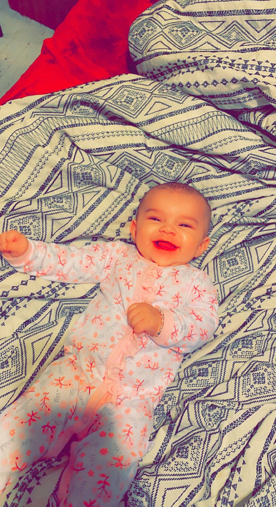 Halo is registered to the contest to win money with this photo: art, baby, baby_toddler_clothing, bedding, cheek, child, comfort, design, fun, happy, linens, pattern, person, pink, room, skin, sleeve, smile, t_shirt, textile