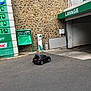 Yanis participe au concours pour gagner de l'argent avec cette photo : advertising, architecture, asphalt, building, car, city, facade, green, infrastructure, road, road_surface, sidewalk, signage, street, tourism, vehicle, wall