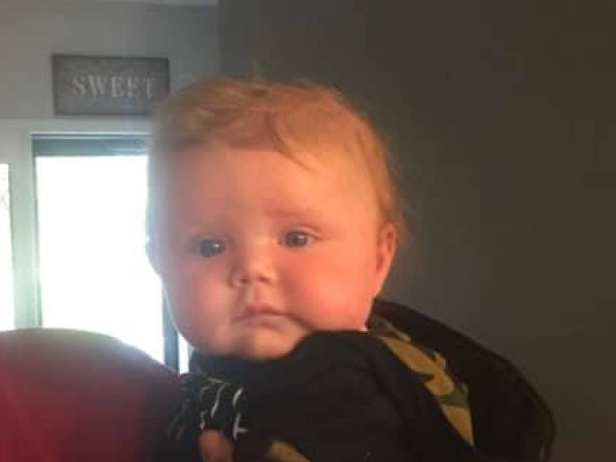 Buddy is registered to the contest to win money with this photo: baby, cheek, chin, dress, ear, eyebrow, eyelash, facial_expression, gesture, hairstyle, iris, lip, mouth, neck, nose, person, skin, smile, standing, thumb