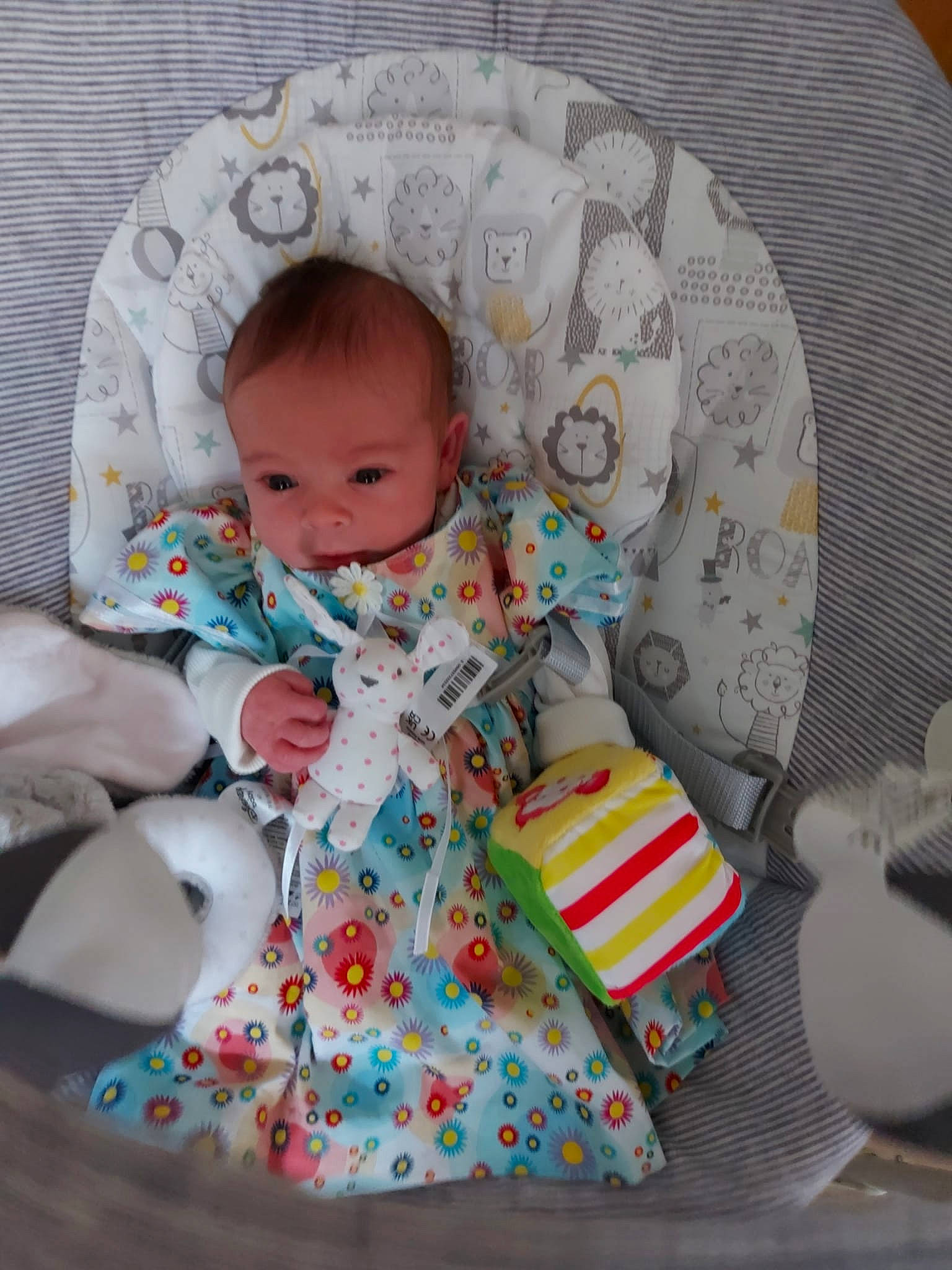 Alaska is registered to the contest to win money with this photo: baby, baby_products, baby_sleeping, baby_toddler_clothing, baby_toys, chair, child, circle, comfort, event, lap, linens, pattern, person, product, room, sitting, skin, sock, textile