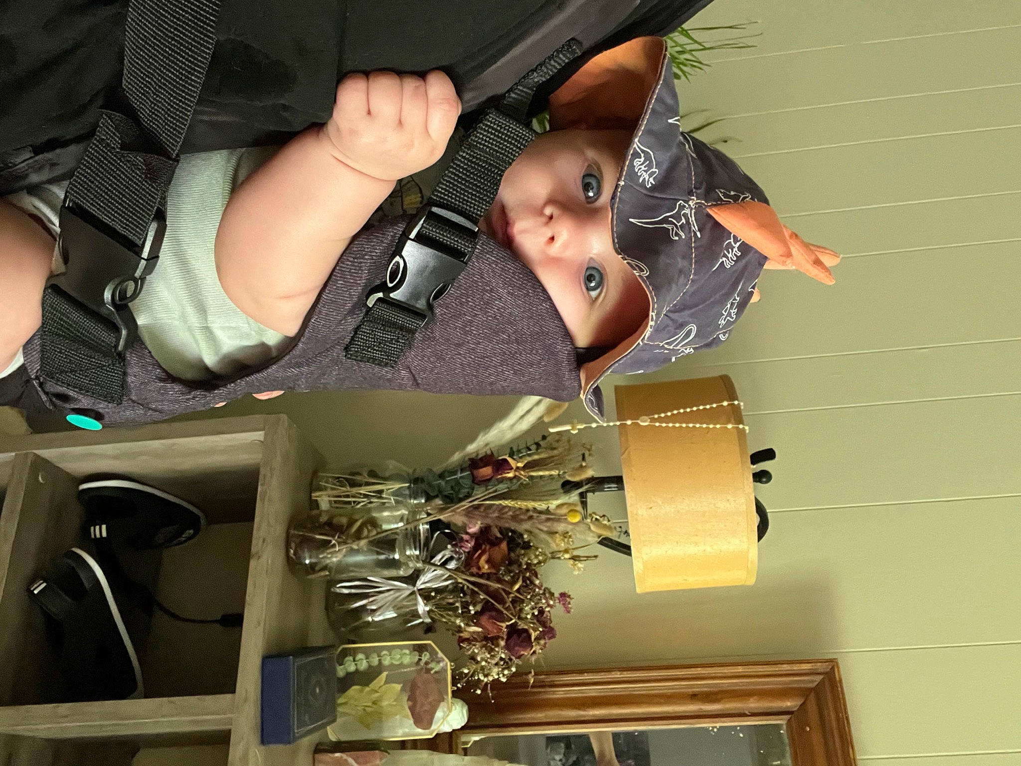 Elias is registered to the contest to win money with this photo: car_seat, eyelash, eyewear, fashion_accessory, flash_photography, gesture, headwear, nail, pattern, person, personal_protective_equipment, thumb, toddler, vehicle_door, wrist