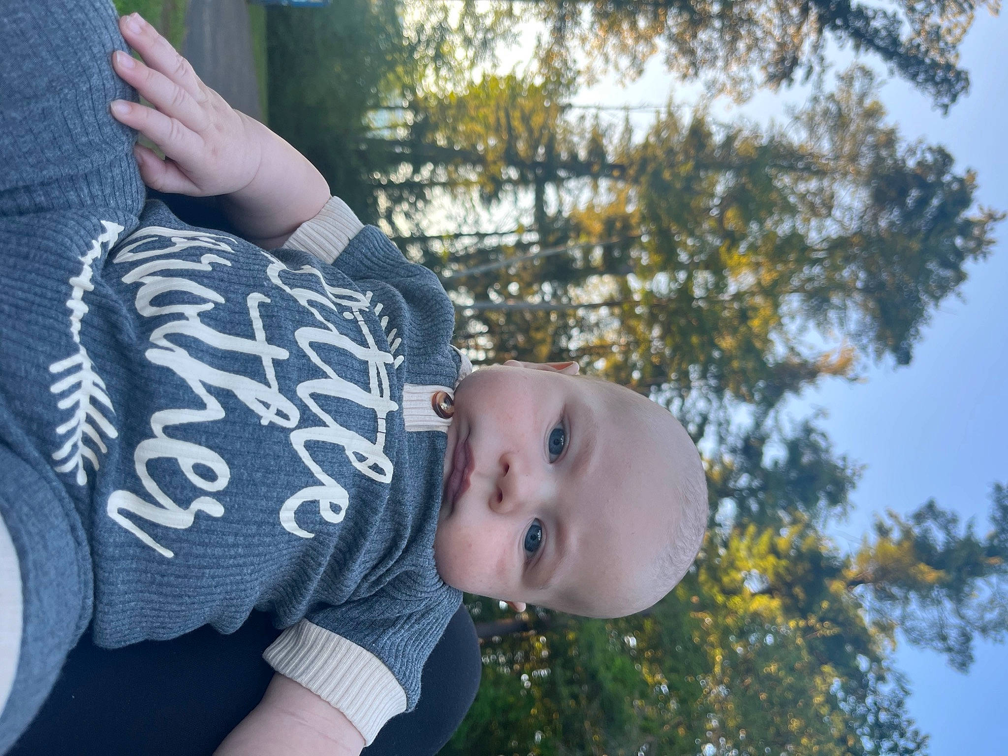 Elias is registered to the contest to win money with this photo: baby, child, elbow, fun, gesture, grass, happy, leaf, leisure, pattern, people_in_nature, person, plant, portrait_photography, recreation, sitting, sky, sleeve, t_shirt, toddler