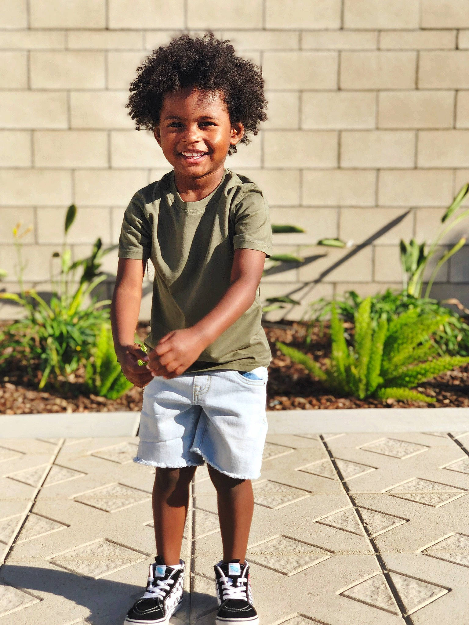 Jacey is registered to the contest to win money with this photo: child, child_model, cool, footwear, fun, hair, hairstyle, joint, joy, neck, person, photograph, photography, play, shoe, shorts, smile, snapshot, standing, street_fashion