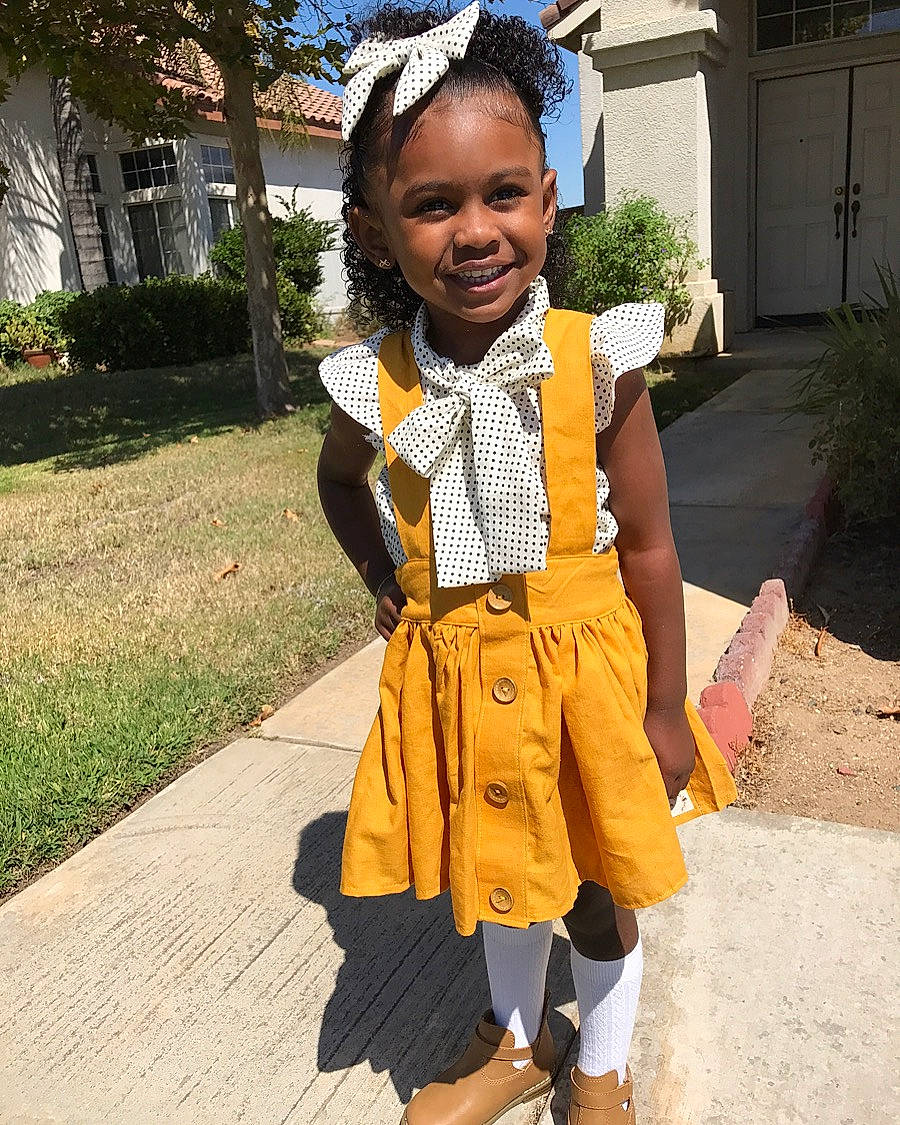 Casey is registered to the contest to win money with this photo: adaptation, child, clothing, costume, fashion, jacket, joy, outerwear, person, smile