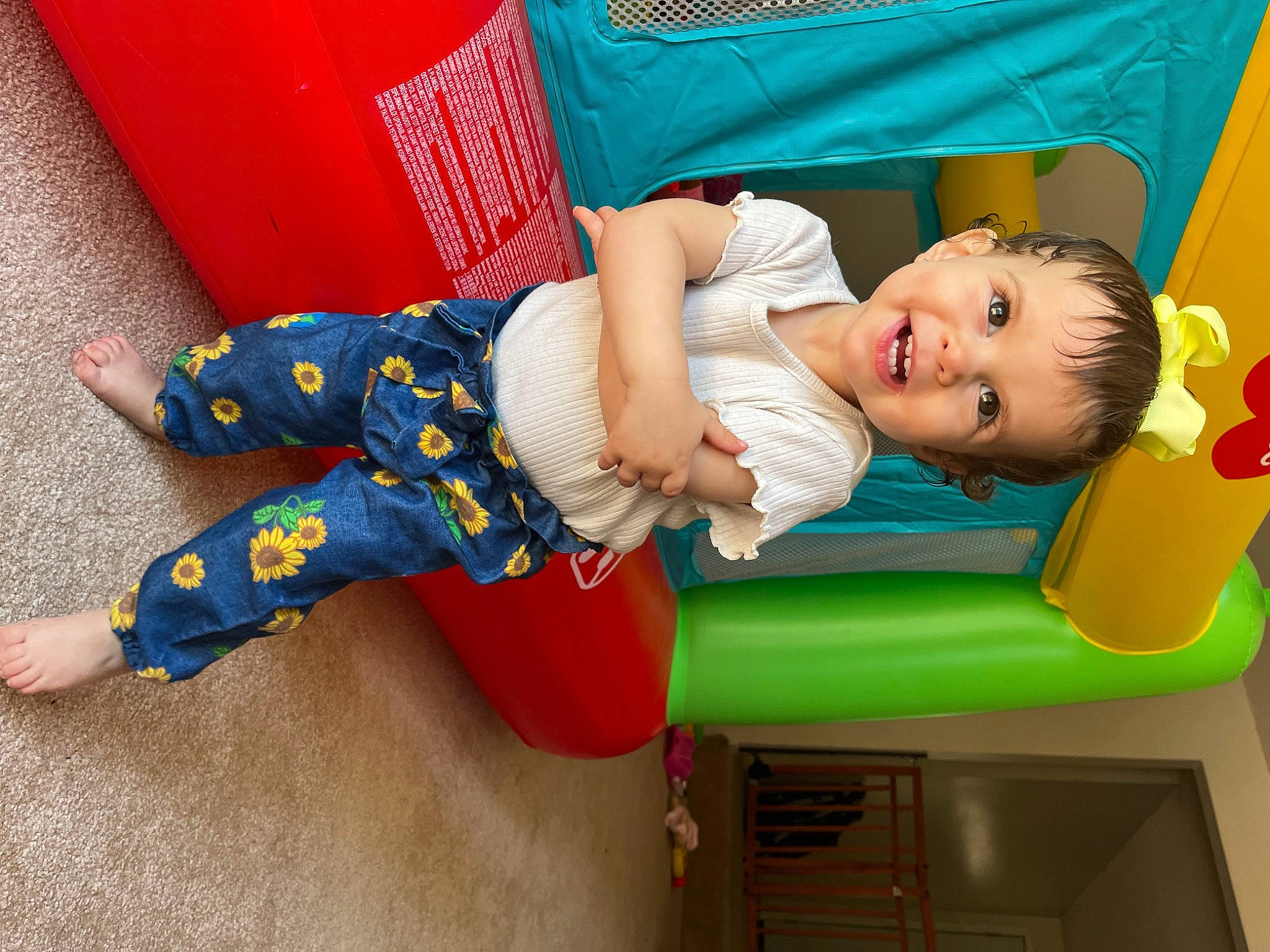 Lila joined the competition — help win amazing prizes! baby, baby_playing_with_toys, baby_products, baby_toddler_clothing, child, clothing, comfort, flooring, fun, green, happy, joy, leg, leisure, person, play, public_space, red, sitting, smile