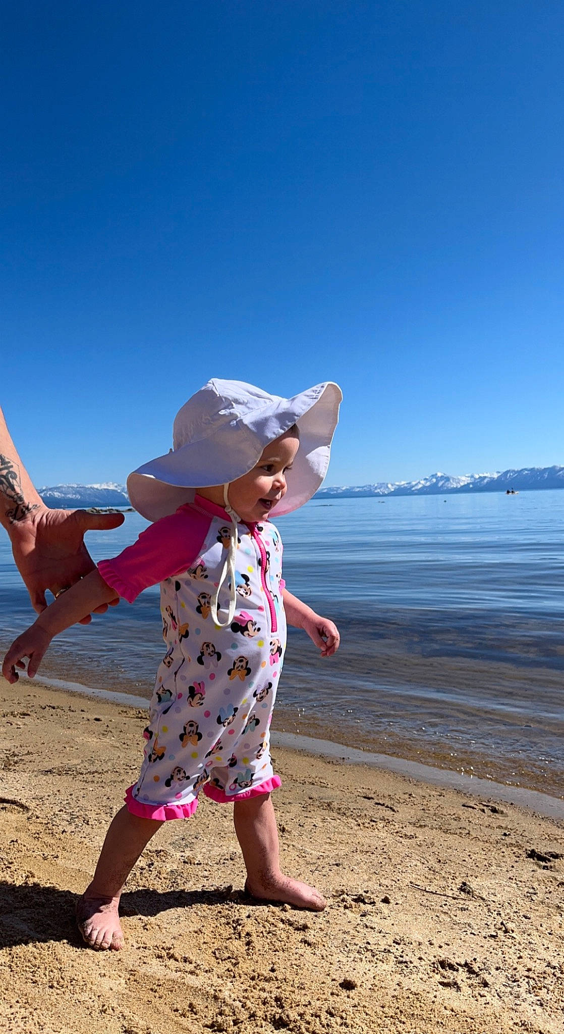 Lila joined the competition — help win amazing prizes! barefoot, beach, coastal_and_oceanic_landforms, dress, finger, gesture, hand, happy, hat, leg, people_in_nature, people_on_beach, person, sand, sky, summer, sun_hat, sunglasses, travel, water
