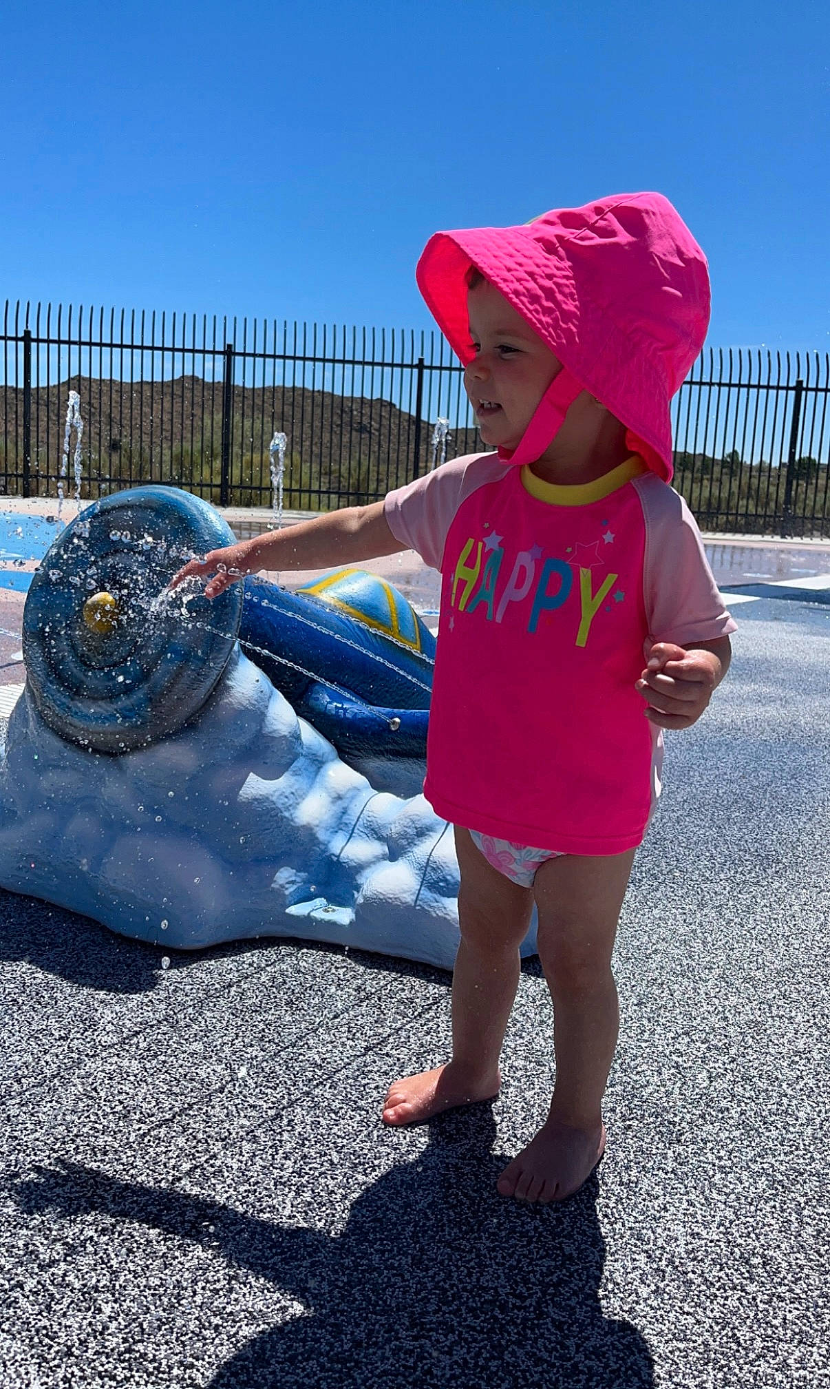 Lila joined the competition — help win amazing prizes! automotive_tire, cap, child, cool, electric_blue, fence, fun, grass, happy, hat, headgear, headwear, leg, leisure, person, recreation, shoe, sky, summer, sun_hat