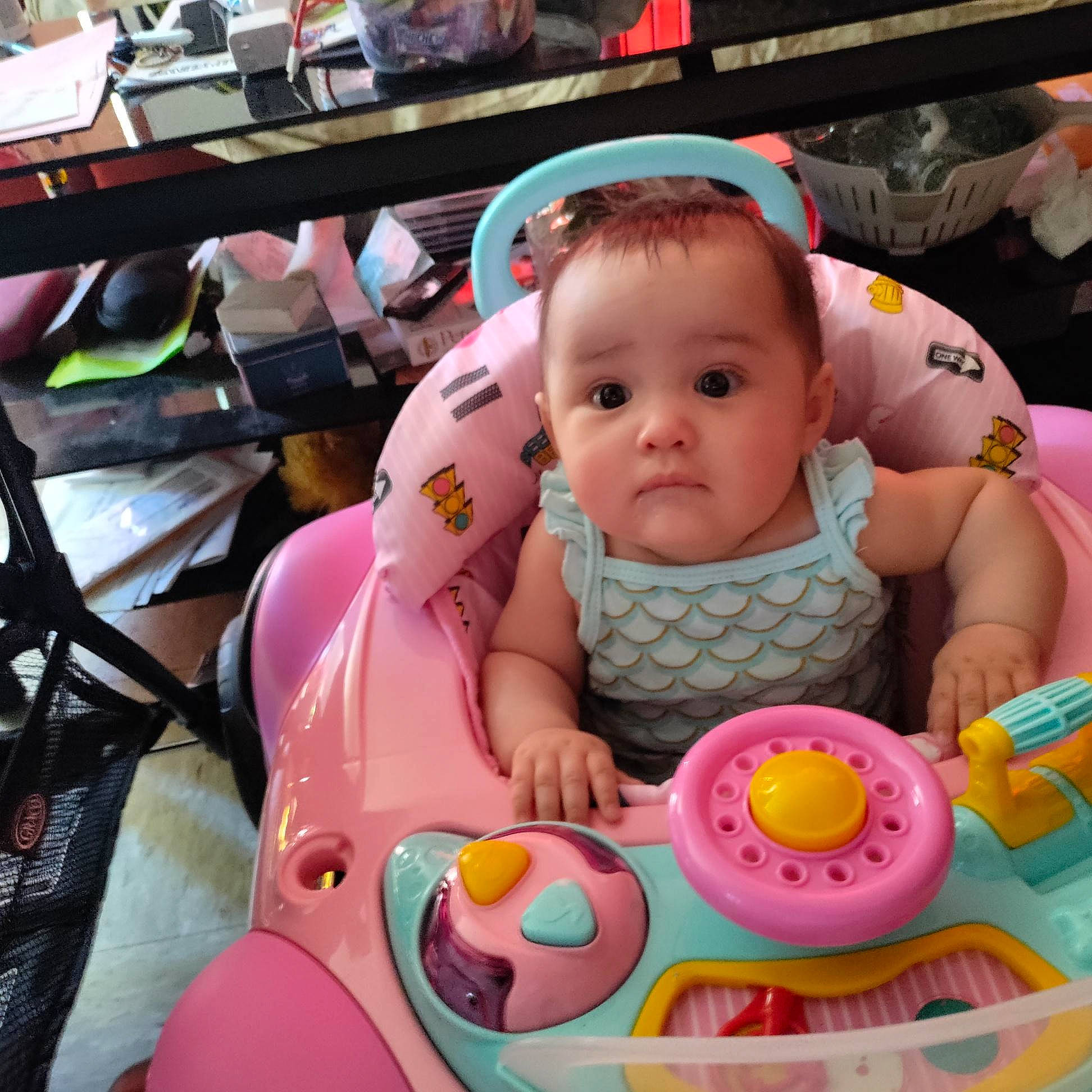 Lana is registered to the contest to win money with this photo: baby, baby_carriage, baby_products, baby_toddler_clothing, baby_toys, bib, cheek, child, facial_expression, fun, happy, leisure, mouth, person, pink, product, sitting, skin, snapshot, toddler