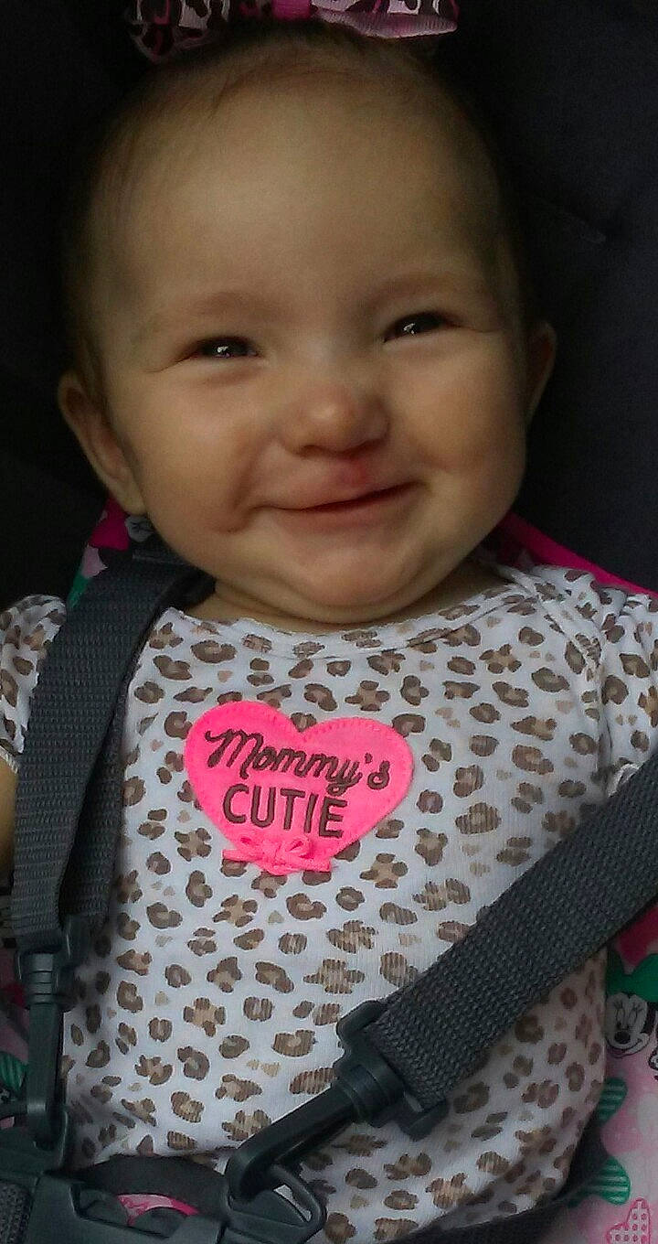 Ariana is registered to the contest to win money with this photo: baby_products, cheek, child, cool, day, eye, face, forehead, girl, hair_accessory, head, infant, joy, lip, nose, pattern, person, pink, product, skin