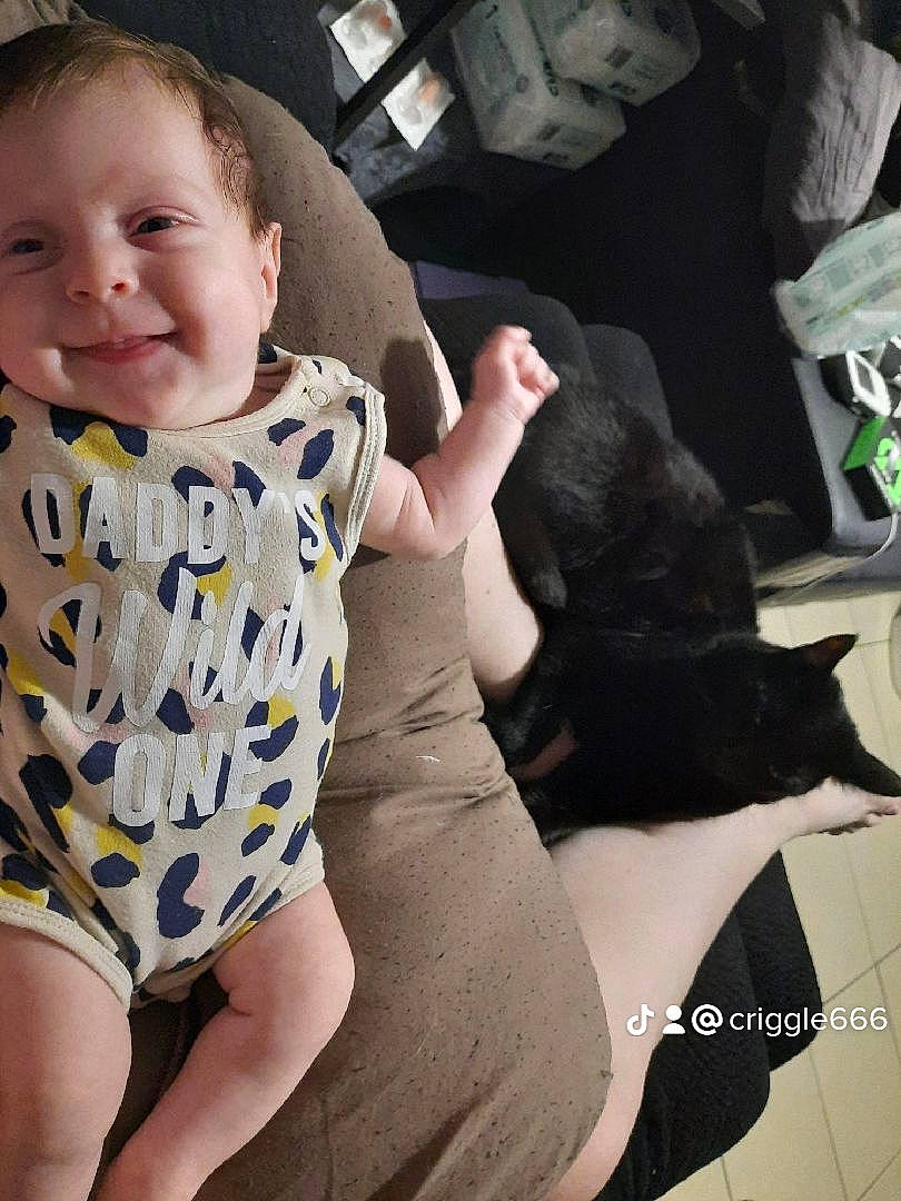 Saphira joined the competition — help win amazing prizes! baby_toddler_clothing, comfort, cool, elbow, finger, gesture, happy, human_leg, joy, knee, lap, leg, neck, person, shoulder, skin, sleeve, smile, thigh, thumb