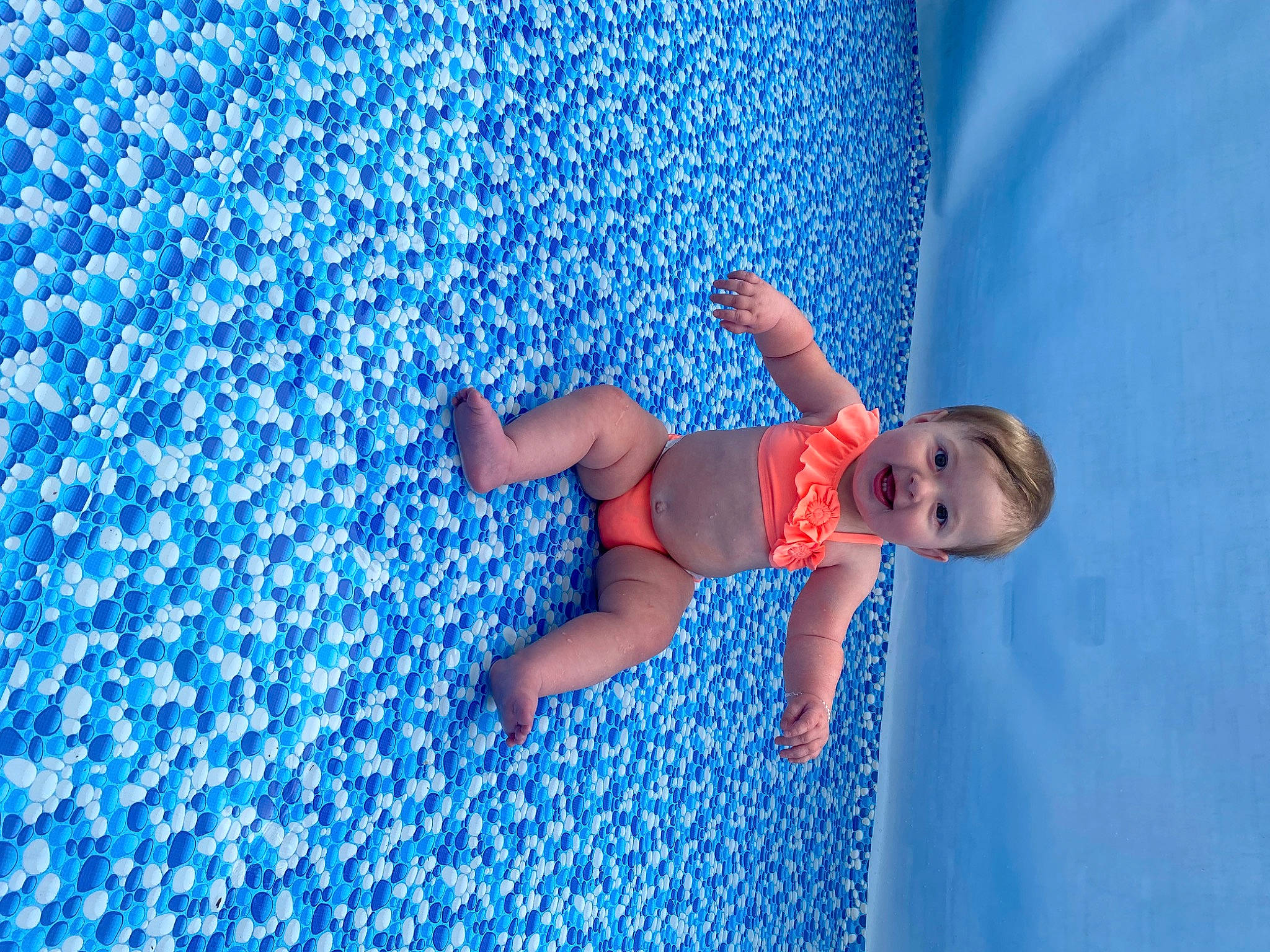 Brynleigh is registered to the contest to win money with this photo: aqua, azure, baby, baby_toddler_clothing, blue, child, cloud, elbow, electric_blue, flooring, foot, fun, human_leg, leisure, linens, pattern, people_in_nature, person, play, t_shirt