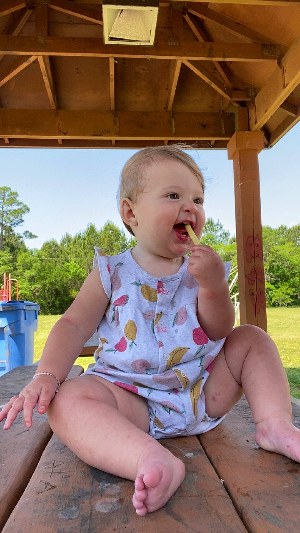 Brynleigh is registered to the contest to win money with this photo: baby_toddler_clothing, facial_expression, finger, fun, grass, hairstyle, happy, human_body, leaf, leisure, person, pink, shorts, skin, sky, smile, summer, thigh, toddler, tree