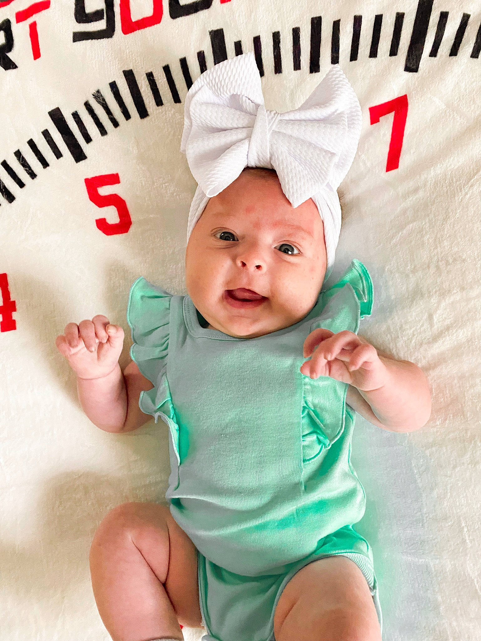 Brynleigh joined the competition — help win amazing prizes! baby, baby_toddler_clothing, cap, cheek, eye, eyelash, face, font, happy, head, headwear, person, pink, red, shorts, sleeve, smile, textile, thigh, thumb
