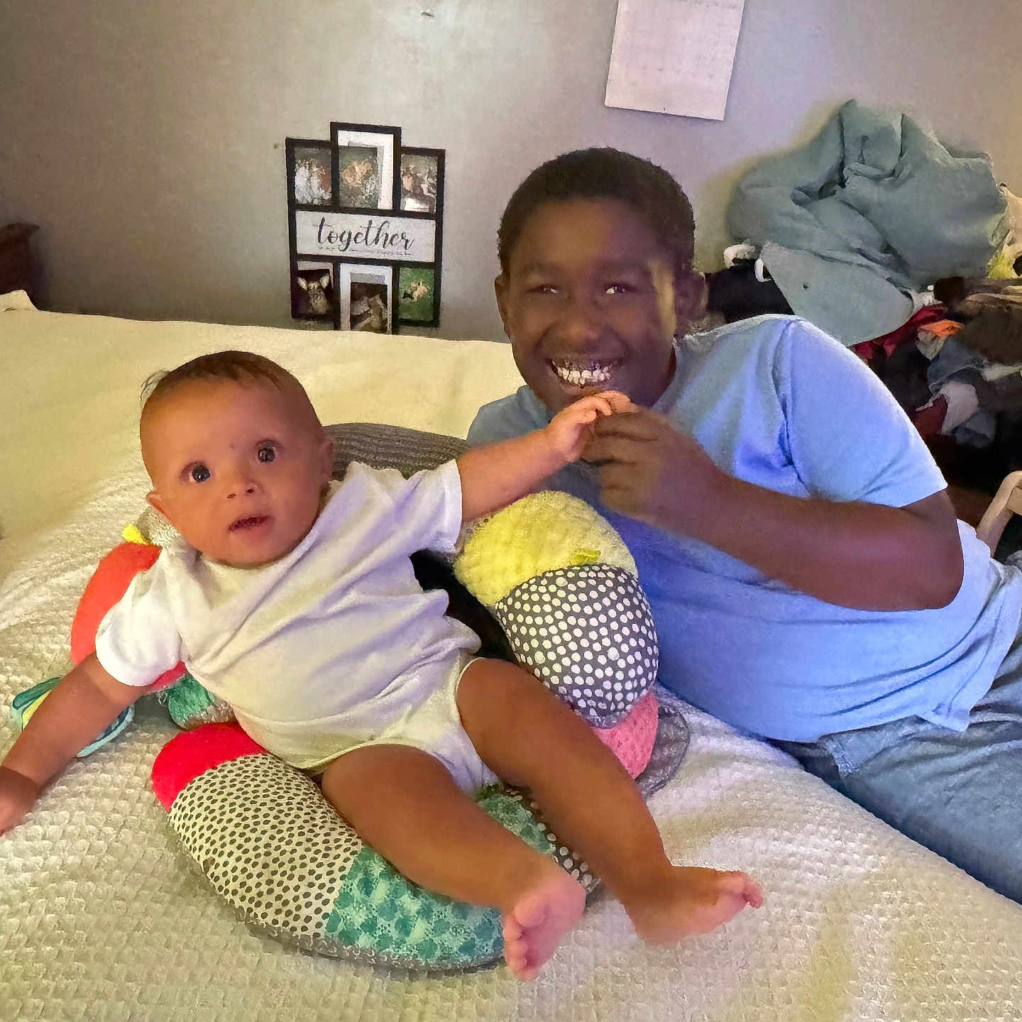 Elijah is registered to the contest to win money with this photo: baby, bed, blanket, casual, child, clothing, curtains, dog, family, fan, furniture, happy, indoor, person, photography, pillow, playful, relaxed, room, smile