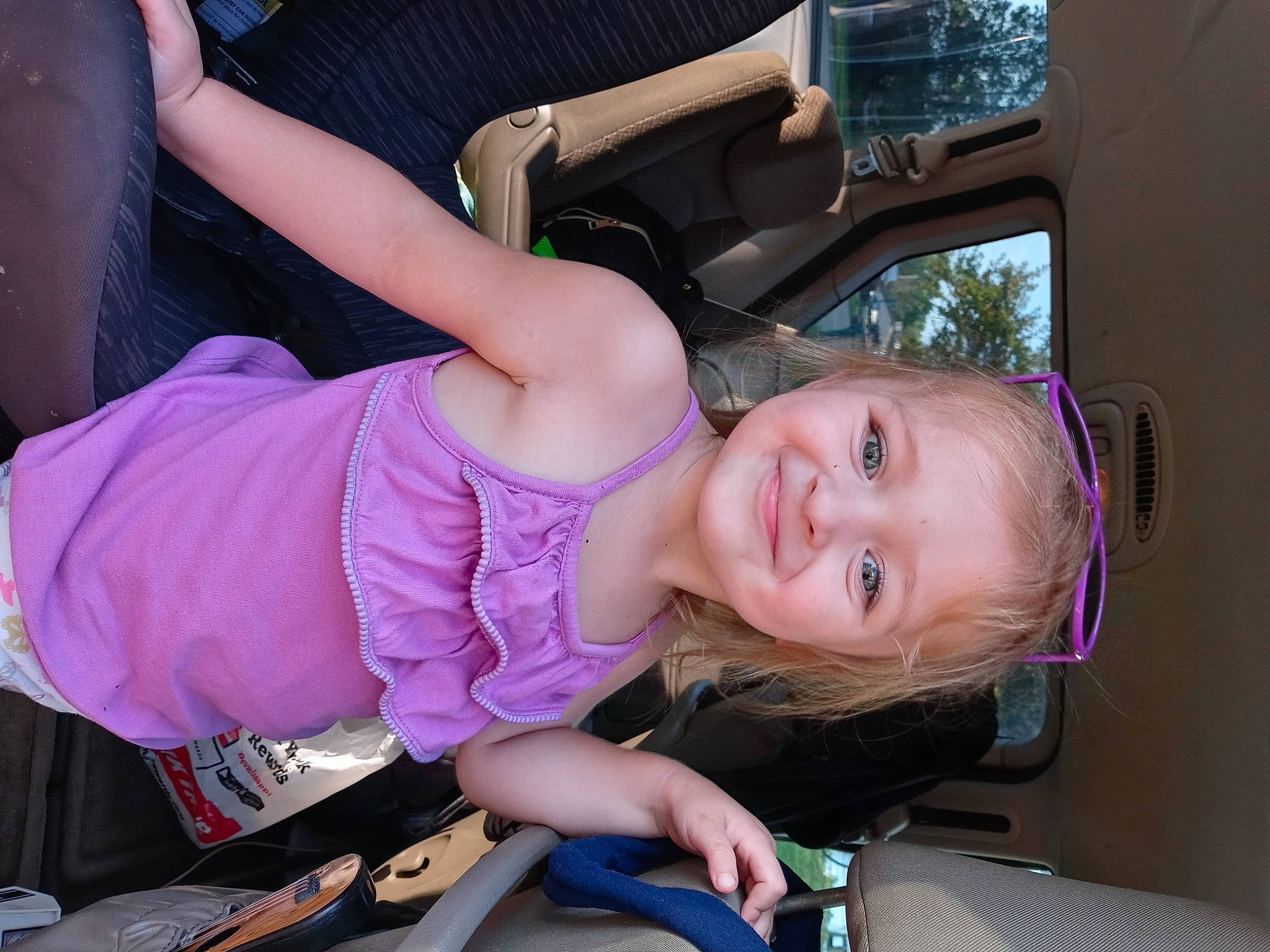 Josey joined the competition — help win amazing prizes! auto_part, automotive_lighting, bumper, eye, face, fun, happy, joy, motor_vehicle, mouth, person, pink, plant, purple, smile, snapshot, tire, toddler, tree, trunk