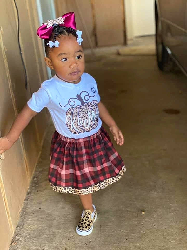 Kamiah is registered to the contest to win money with this photo: baby_toddler_clothing, child, cool, fashion_design, fun, hairstyle, hat, magenta, pattern, person, pink, plaid, purple, sleeve, sock, standing, street_fashion, tartan, textile, toddler
