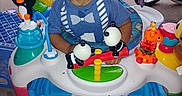 Izaiah joined the competition — help win amazing prizes! activity_walker, baby_toys, bicycle, blue_clothing, child, colorful, concrete, curious, curly_hair, cute, fun, grass, outdoor, person, play, smiling, toddler, toy_fish, toy_pandas, toy_penguin