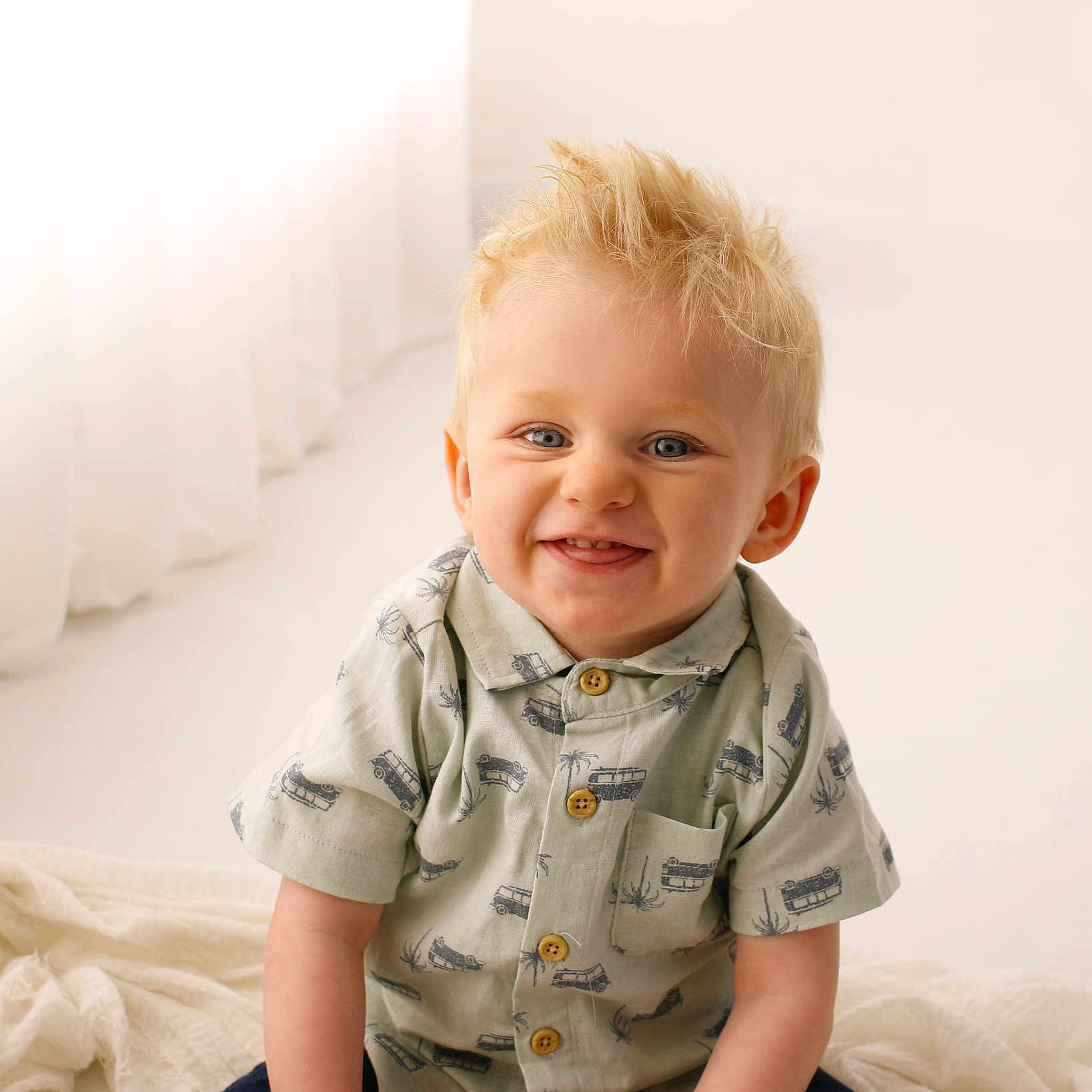 Brodie joined the competition — help win amazing prizes! baby, babylaughing, blonde, clothing, couch, face, hair, happy, head, jeans, laughing, pants, person, photography, portrait, shirt, sitting, sleeve, smile, t_shirt