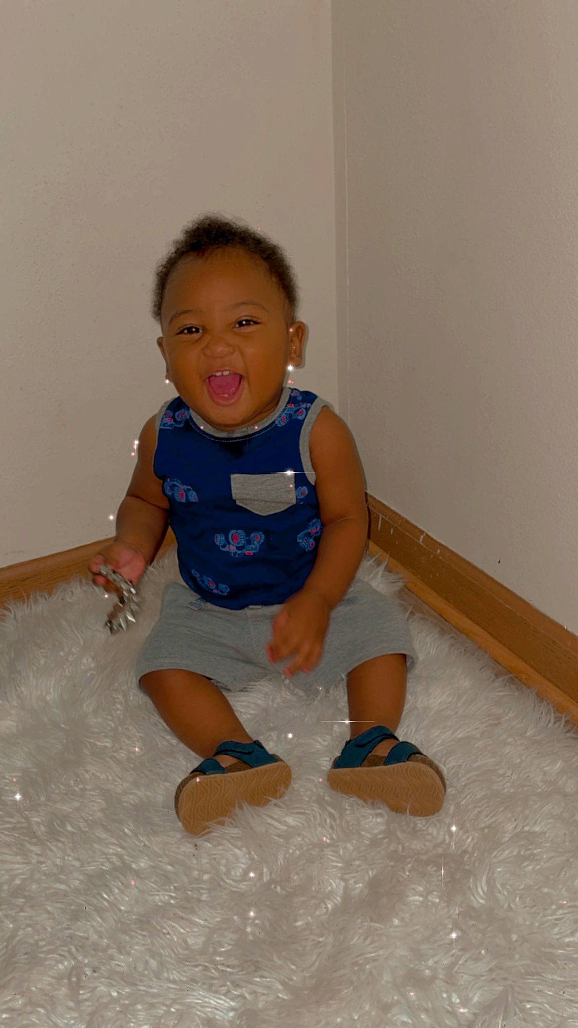 Emeries joined the competition — help win amazing prizes! baby_toddler_clothing, barefoot, cheek, chin, face, floor, flooring, hair, happy, human_body, human_leg, knee, leg, person, shoulder, sleeve, smile, sock, thigh, toddler