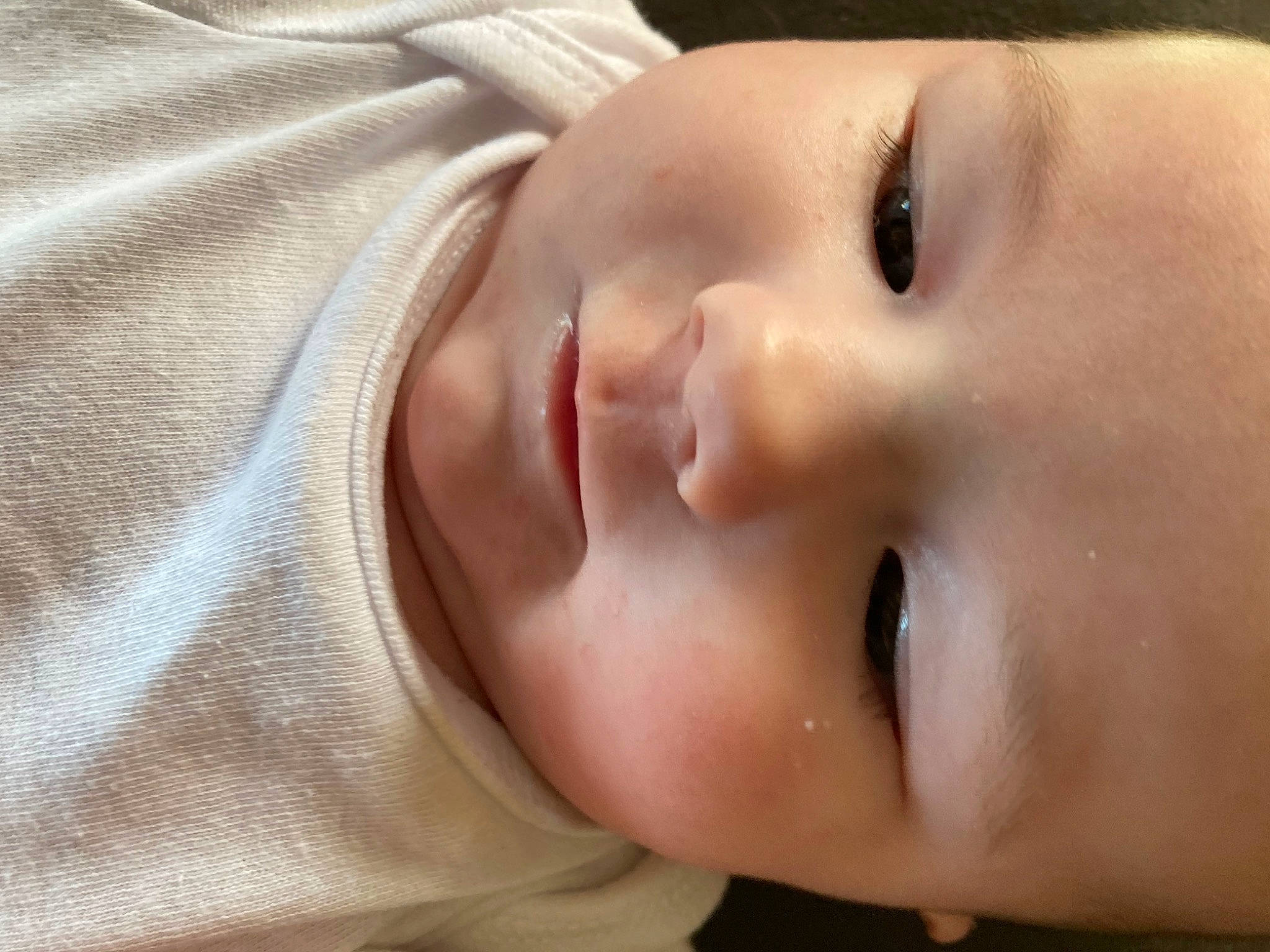 Evelyn is registered to the contest to win money with this photo: baby, cheek, child, close_up, ear, eye, eyebrow, eyelash, forehead, grass, happy, iris, lip, mouth, neck, no_expression, nose, person, skin, smile