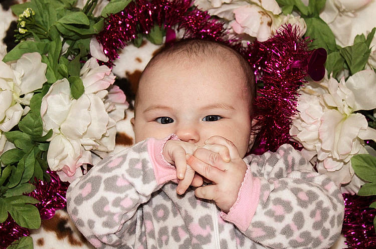 Evelyn joined the competition — help win amazing prizes! baby, baby_toddler_clothing, cut_flowers, eye, floral_design, flower, flower_arranging, grass, happy, head, iris, leaf, lip, magenta, pattern, person, petal, pink, plant, textile
