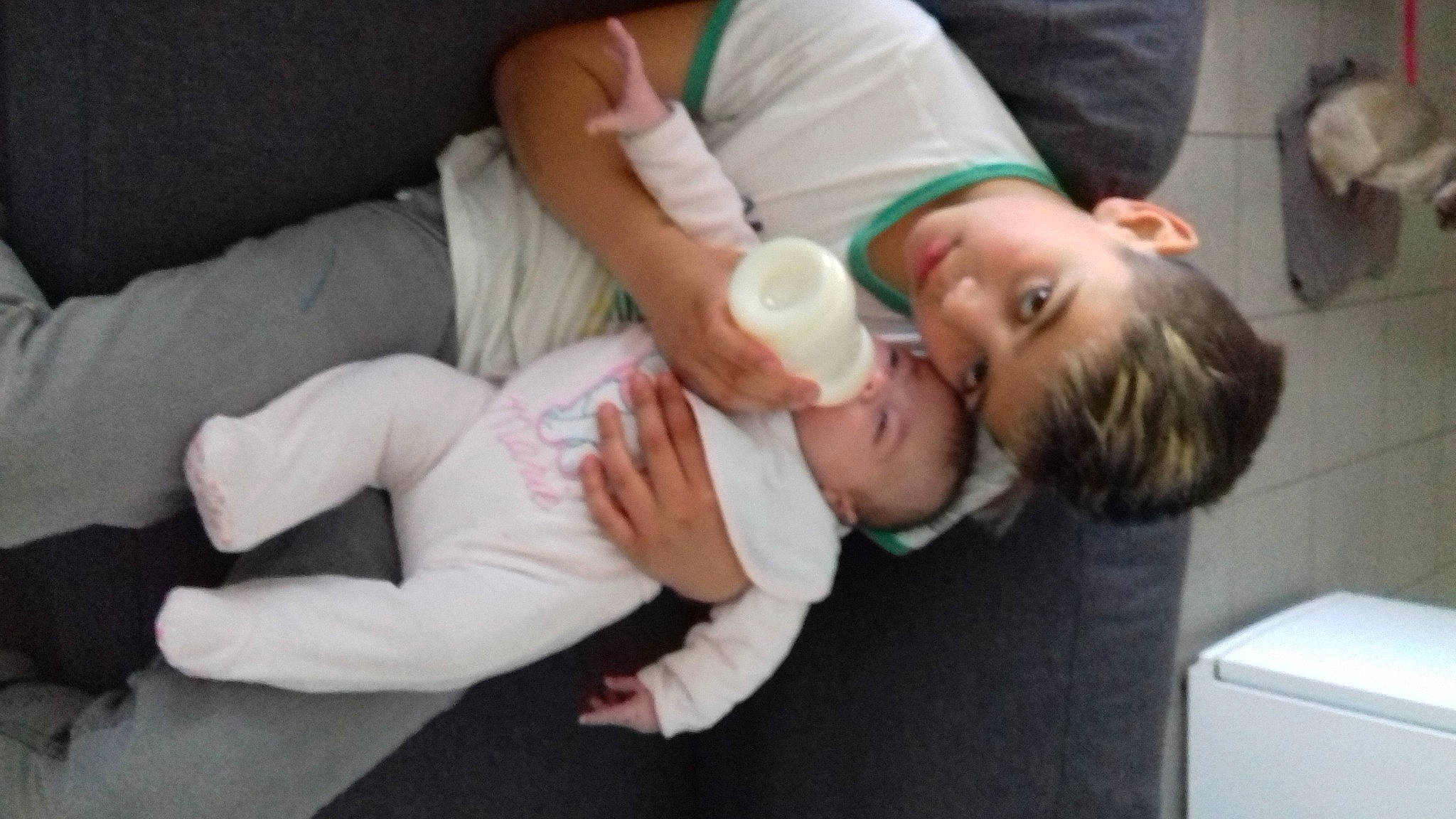 Morgan participe au concours pour gagner de l'argent avec cette photo : abdomen, baby, baby_products, baby_toddler_clothing, cheek, child, comfort, drinkware, elbow, eye, gesture, human_leg, knee, mouth, nail, person, room, sitting, thigh, thumb