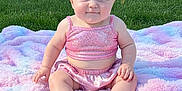 Paisley joined the competition — help win amazing prizes! baby, child, infant, pink_clothing, headband, blanket, grass, outdoor, sunny, park, butterfly, cute, smiling, sitting, footwear, nature, greenery, portrait, sparkly, happy