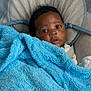 Destin joined the competition — help win amazing prizes! baby, blanket, blue, cushion, infant, face, eyes, seat, soft_toys, star, curious, child, indoors, comfort, cozy, portrait, wrapped, cute, young, resting