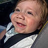 Andrew is registered to the contest to win money with this photo: toddler, child, smiling, car_seat, seatbelt, happy, face, baby, young_child, casual_clothing, short_hair, indoors, daylight, closeup, cute, skin, head, cheeks, expression, person