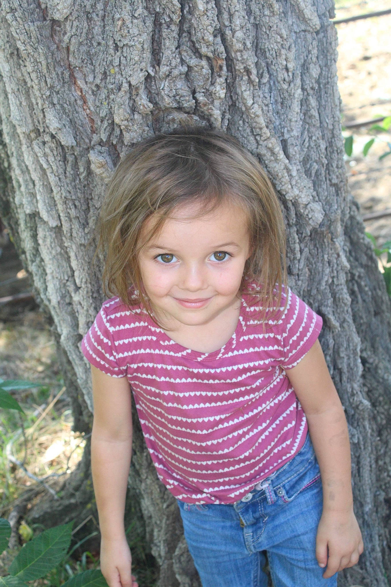 Kynleigh is registered to the contest to win money with this photo: botany, branch, clothing, eye, face, facial_expression, grass, hair, hairstyle, iris, jeans, joy, leaf, nature, organ, people_in_nature, person, plant, skin, smile