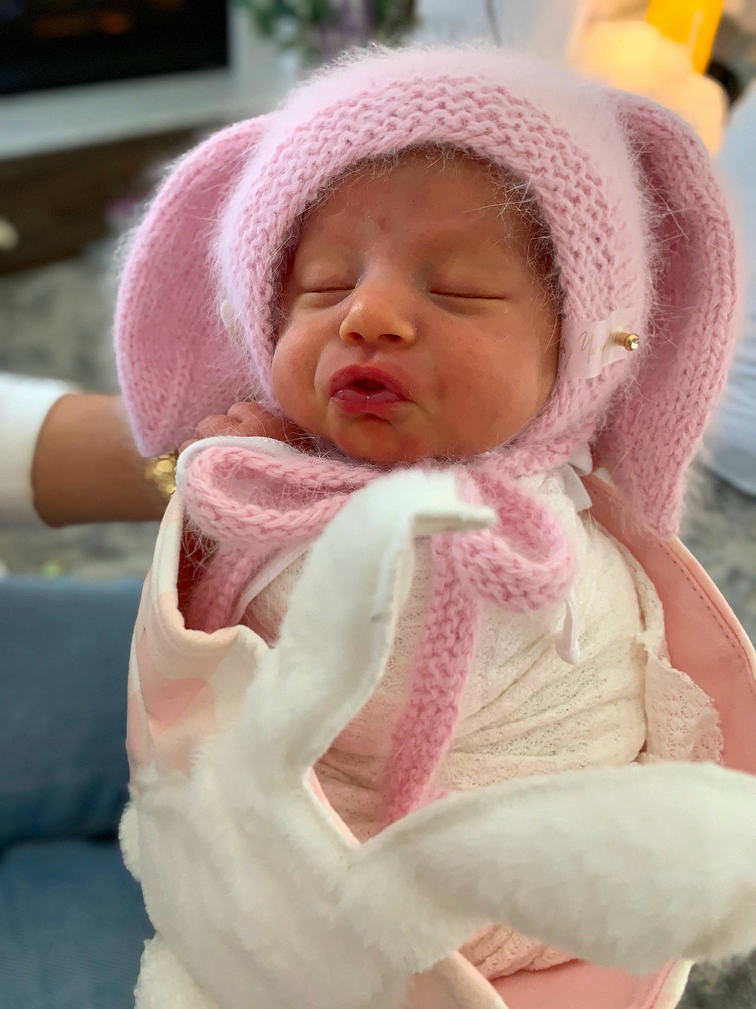 Beatrice is registered to the contest to win money with this photo: baby, baby_products, baby_toddler_clothing, cap, cheek, child, comfort, dress, eyebrow, face, headwear, knit_cap, linens, lip, nose, outerwear, person, pink, skin, sleeve