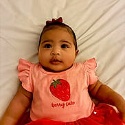 Mavie Ocean joined the competition — help win amazing prizes! baby, infant, child, cute, pink_clothing, strawberry, bow, dress, red, white_background, portrait, smiling, happy, lying_down, chubby_cheeks, indoors, soft_lighting, closeup, person, adorable