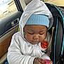 baby, baby_bottle, car_interior, car_seat, casual, child, clothing, cute, face, hand, hat, hoodie, infant, jeans, person, portrait, seat, seatbelt, window, young_child