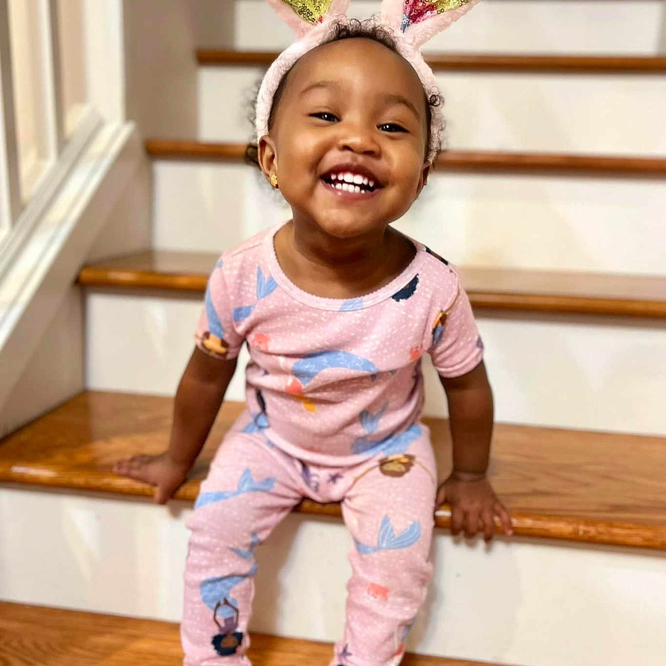 Amaya is registered to the contest to win money with this photo: architecture, baby, babylaughing, building, child, clothing, face, female, girl, happy, head, house, housing, pajamas, person, photography, portrait, sitting, sleeve, smile