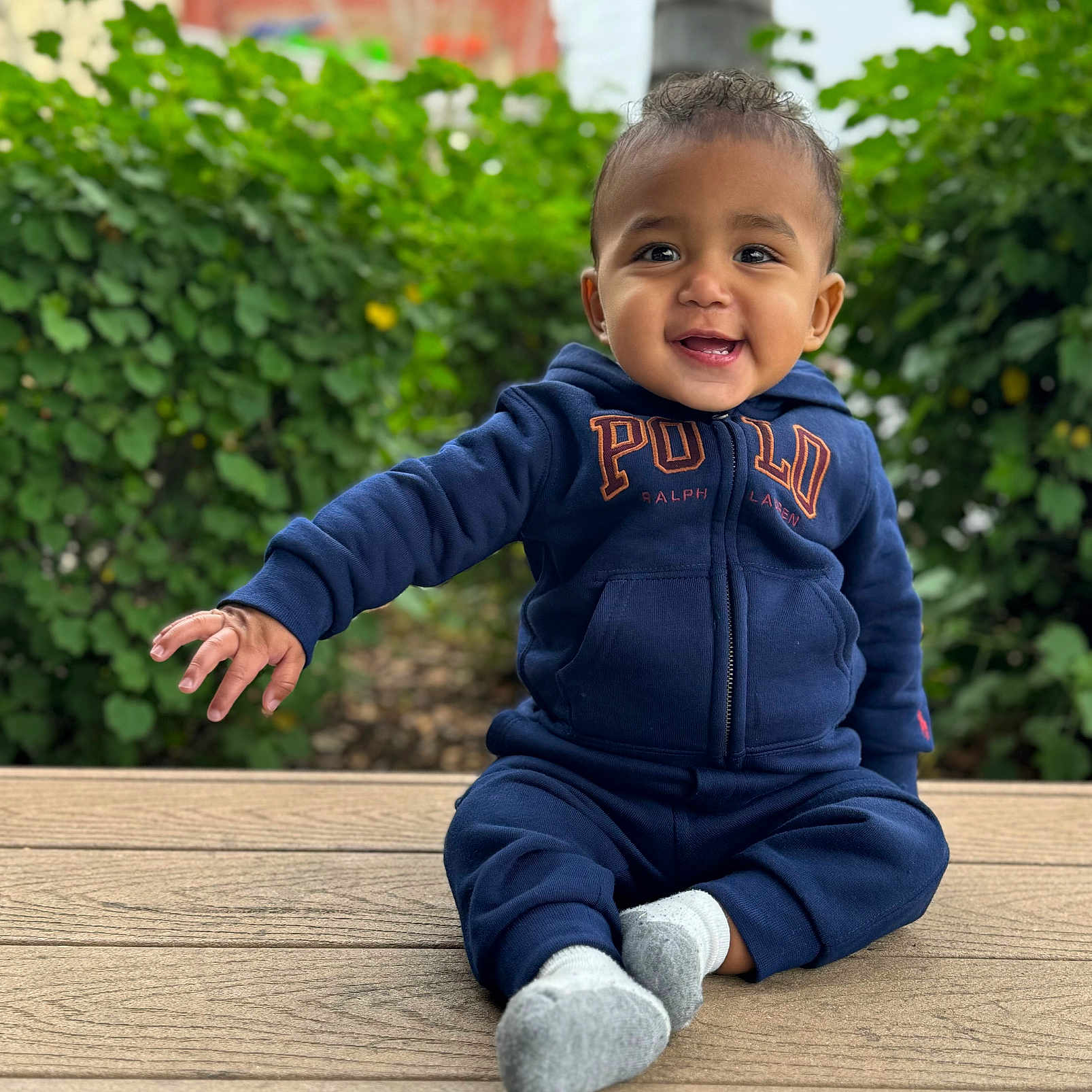 Julian is registered to the contest to win money with this photo: architecture, baby, babylaughing, backyard, bench, bodypart, boy, brick, building, child, city, clothing, coat, dress, face, finger, fleece, flower, flowerarrangement, footwear