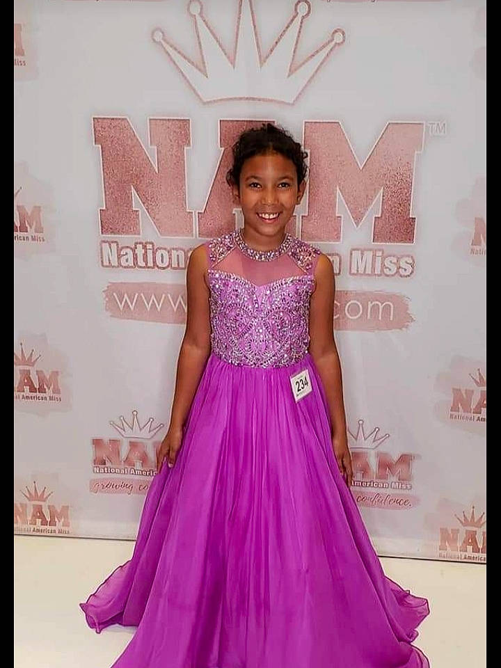 Kiya is registered to the contest to win money with this photo: a_line, bridal_party_dress, carpet, clothing, dress, event, fashion, fashion_model, formal_wear, gown, hairstyle, haute_couture, joy, lavender, lilac, magenta, neck, person, pink, purple