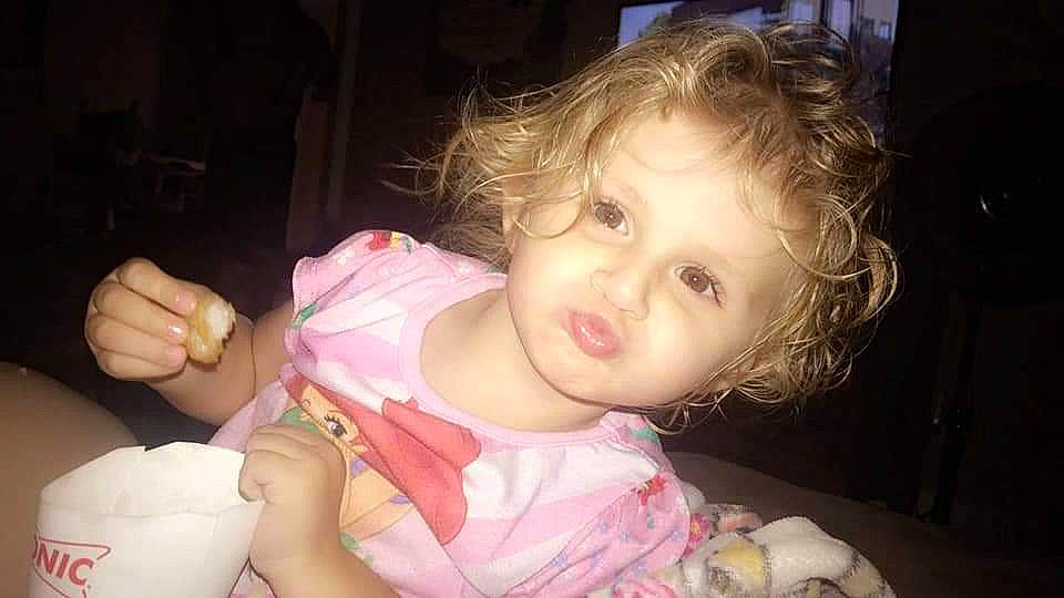 Mariella is registered to the contest to win money with this photo: baby, beauty, brown_hair, cheek, child, eye, face, finger, fun, hand, iris, lip, mouth, neck, nose, person, pink, play, skin, smile